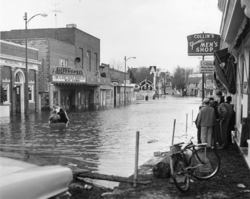This historic photo shows a flooded downtown Milton as a result of the Storm of 1962. The Milton Theatre is on the left. PHOTO COURTESY OF MILTON THEATRE